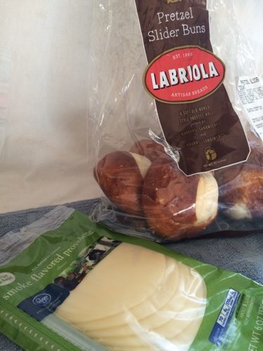 package of provolone cheese slices and a bag of small pretzel rolls