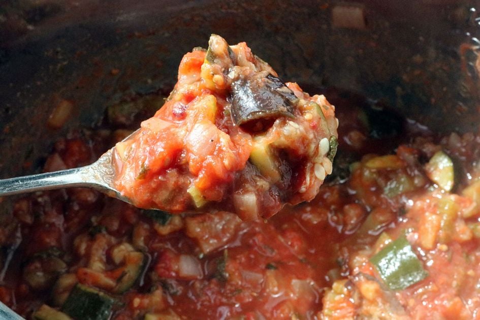 Stir tomato sauce into caponata after it releases from pressure