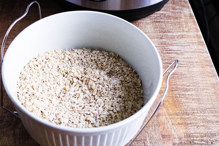 Add dry oats to casserole dish.