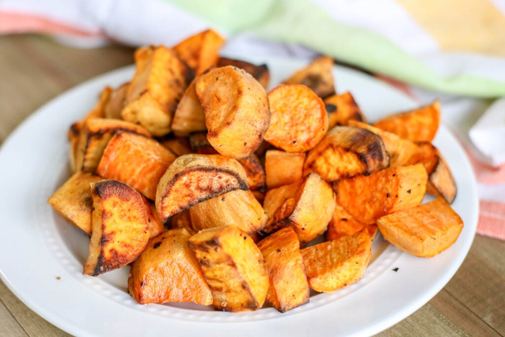 Air fryer roasted sweet potatoes on a white plate