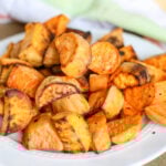 Air fryer roasted sweet potatoes on a white plate
