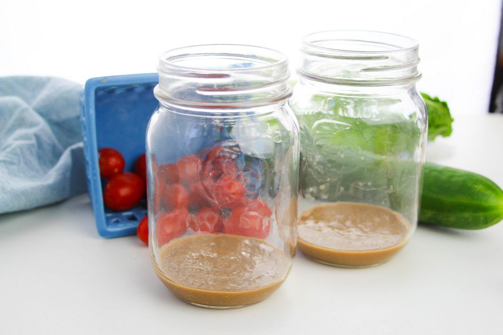 Salad in a jar with dressing on the bottom