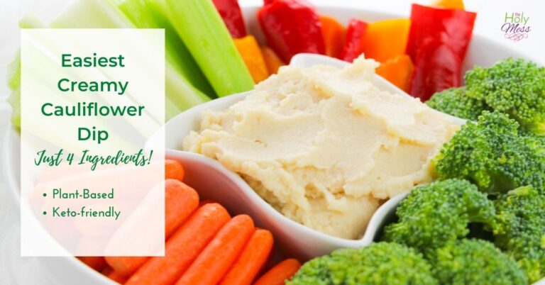 Creamy Cauliflower Dip in a small white bowl with fresh cut vegetables surrounding it