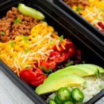 burrito bowls with optional add ins - avocado, shredded cheese and jalapenos.