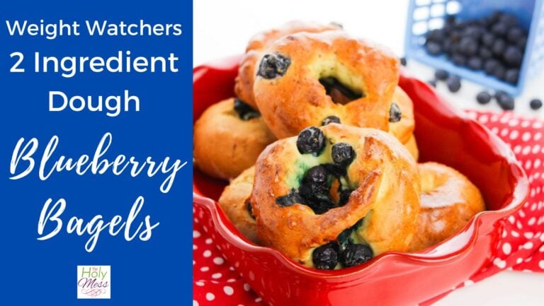 Cover photo for 2 Ingredient Dough Blueberry Bagels - Bagels in a red bowl with blueberries next to it.
