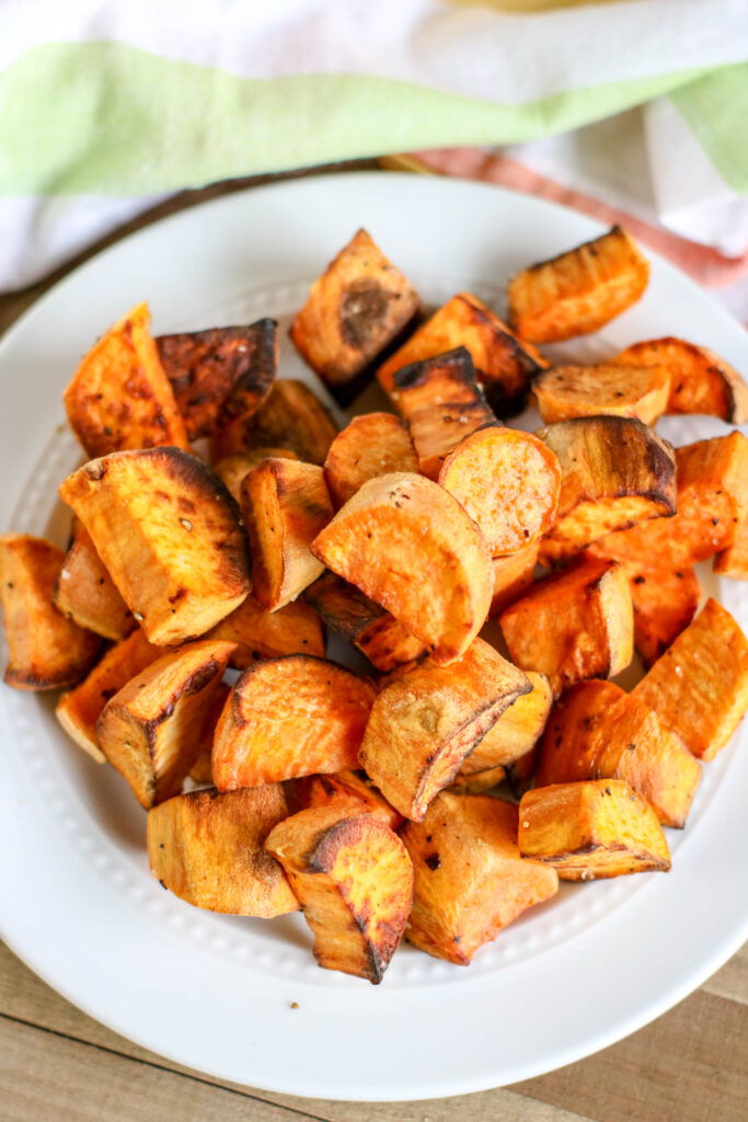 Roasted sweet potatoes on a white plate