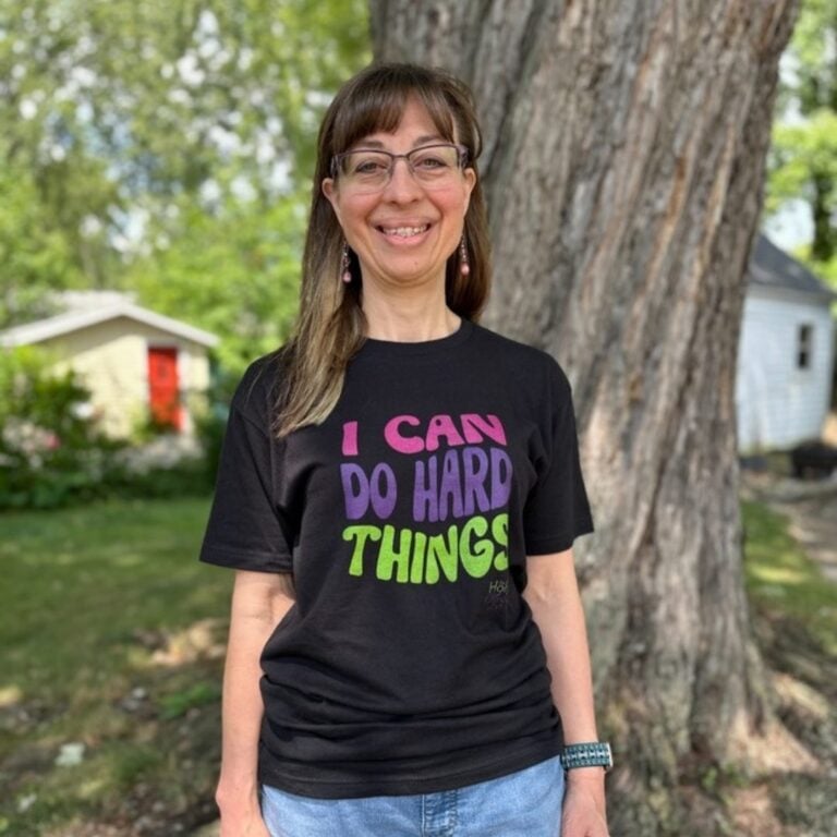 Sara Borgstede wearing a black I Can Do Hard Things t-shirt