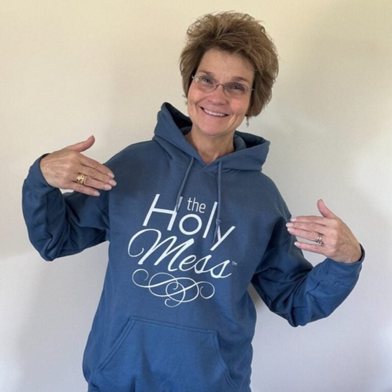 Holy Mess member in a blue The Holy Mess hoodie