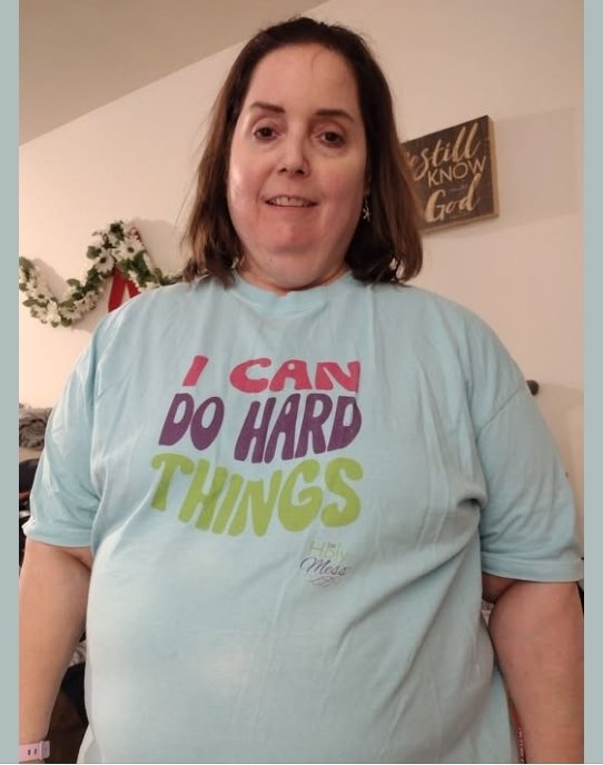 Holy Mess member in a blue I Can Do Hard Things t-shirt
